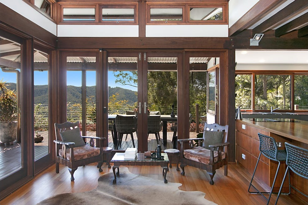 Sitting room opening to the deck and view