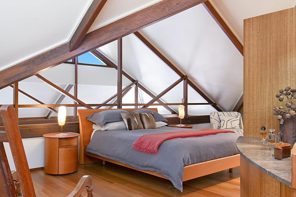 Loft-style master retreat beneath the trusses