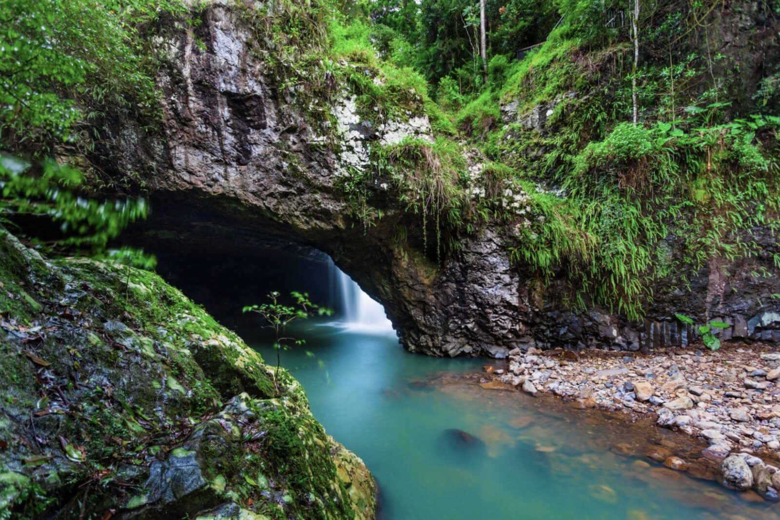 A grotto waterfall and turquoise pool